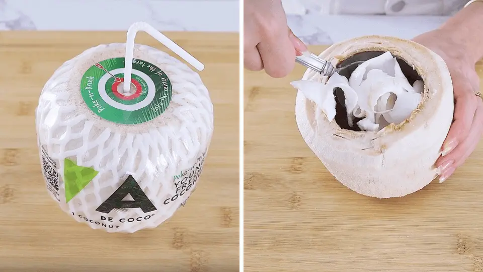 Poke-n-Drink coconut with a straw and its opened shell showing fresh flesh